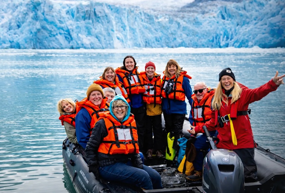 People sharing an expedition experience in Alaska, from the Land and Sea advisory deck
